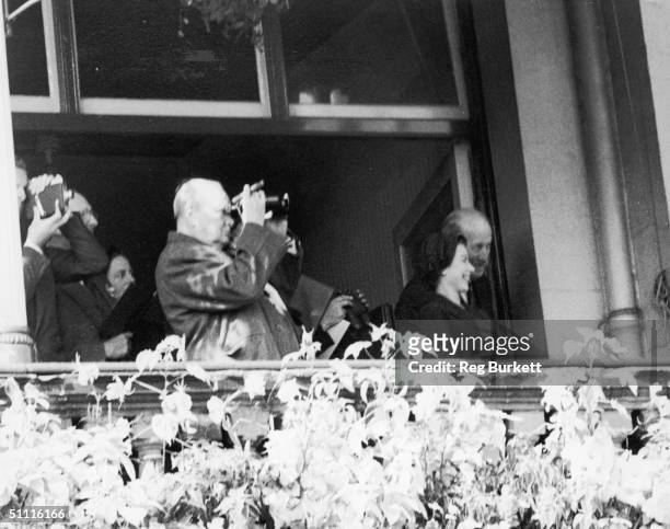 British statesman Winston Churchill and Queen Elizabeth II watch the St Leger at Doncaster, 12th September 1953.