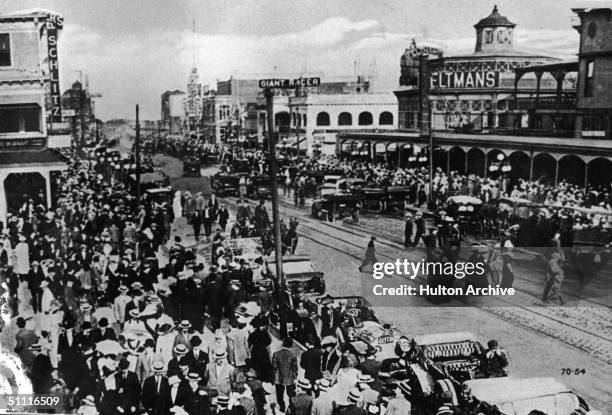 Postcard view of Surf Avenue, Coney Island, Brooklyn, New York, circa 1910. The view looks east with Feltman's restaurant and resort in its original...