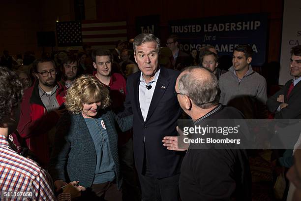Jeb Bush, former Governor of Florida and 2016 Republican presidential candidate, center, greets attendees during a town hall event at the Columbia...