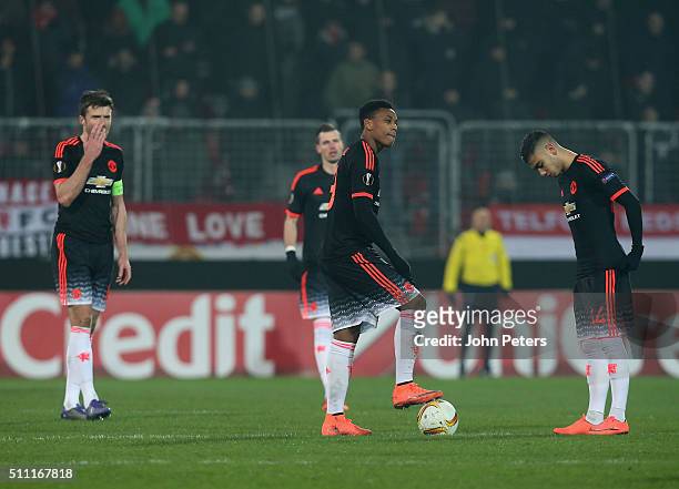 Michael Carrick, Anthony Martial and Andreas Pereira of Manchester United react to Paul Onuachu of FC Midtjylland scoring their second goal during...