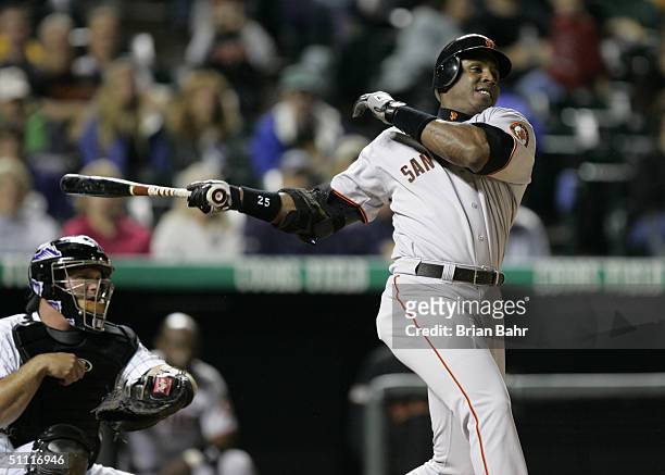 Barry Bonds of the San Francisco Giants swings the bat during the game against the Colorado Rockies at Coors Field on July 16, 2004 in Denver,...