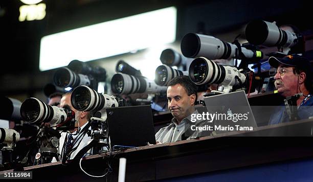 Photojournalists work from the main camera stand during the Democratic National Convention July 26, 2004 at the FleetCenter in Boston, Massachusetts....