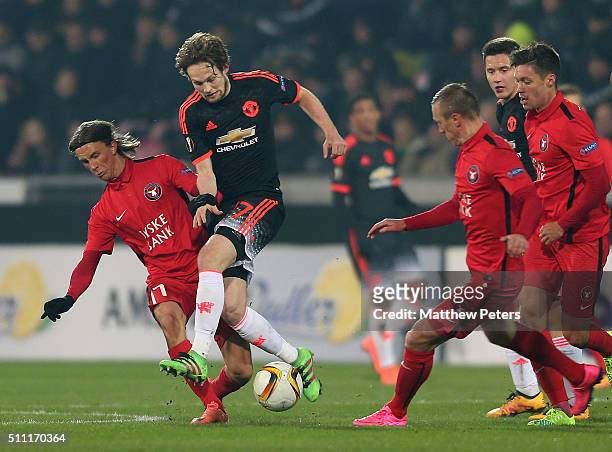Daley Blind of Manchester United in action with Kristoffer Olsson of FC Midtjylland during the UEFA Europe League match between FC Midtjylland and...