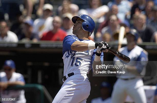 Outfielder Carlos Beltran of the Kansas City Royals swings at a Detroit Tigers pitch during the game at Kauffman Stadium on June 24, 2004 in Kansas...