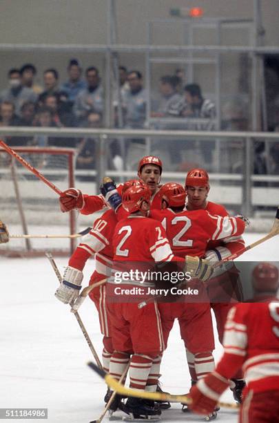 Winter Olympics: Soviet Union Alexander Yakushev victorious with teammates on ice during game vs Czechoslovakia at Makomanai Ice Arena. Sequence....