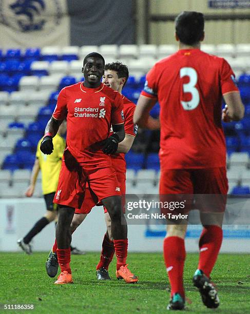 Sheyi Ojo of Liverpool celebrates his first goal of the match with team mates Matthew Virtue and Jose Enrique during the Liverpool v Middlesbrough...