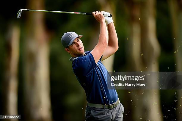 Luke List takes his second shot on the 13th hole during round one of the Northern Trust Open at Riviera Country Club on February 18, 2016 in Pacific...