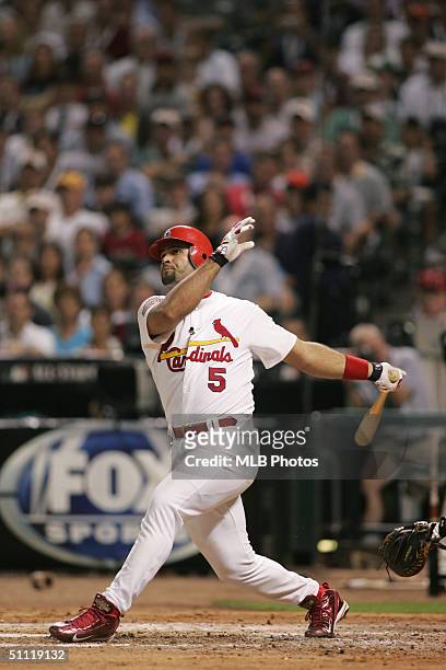 National League All-Star Albert Pujols of the St. Louis Cardinals doubles in the fourth inning during the Major League Baseball All-Star Game at...