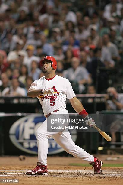 National League All-Star Albert Pujols of the St. Louis Cardinals doubles in the fourth inning during the Major League Baseball All-Star Game at...