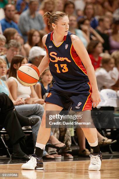 Lindsay Whalen of the Connecticut Sun looks to mak a play on the dribble during the game against the Minnesota Lynx on July 14, 2004 at the Target...