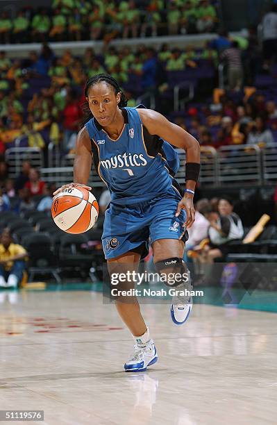 Chamique Holdsclaw the Washington Mystics drives against the Los Angeles Sparks during game at Staples Center on July 21, 2004 in Los Angeles,...