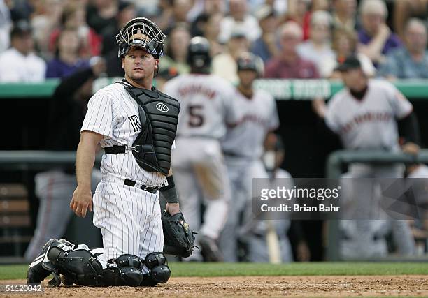 Catcher Todd Greene of the Colorado Rockies looks on during the game against the San Francisco Giants at Coors Field on July 17, 2004 in Denver,...