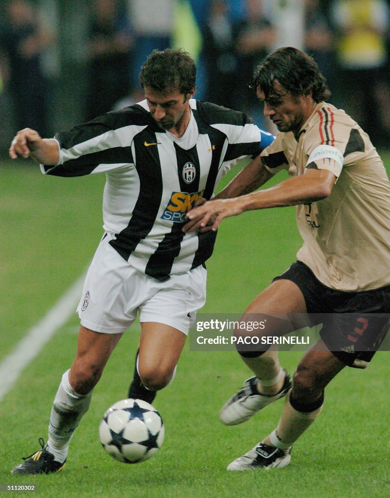 AC Milan's captain Paolo Maldini (R) tri