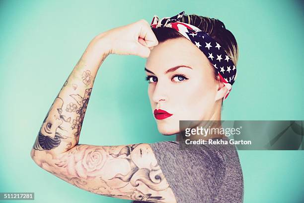 pin up woman striking a strong woman pose - pin up girl tattoo stock pictures, royalty-free photos & images