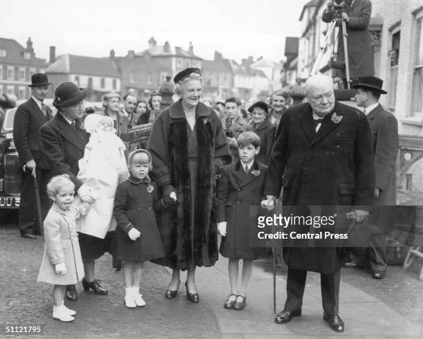 British prime minister Winston Churchill and his wife Clementine attend the christening of their grandchild Charlotte at Westerham Parish Church, 6th...