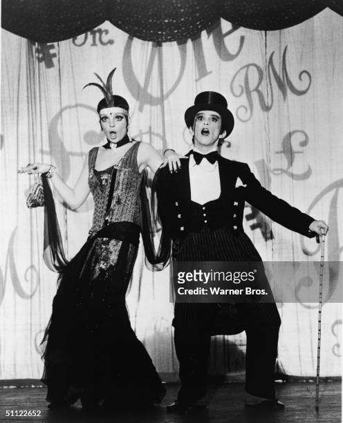 American actors and singers Liza Minnelli and Joel Grey perform on stage as nightclub performers in Germany during the Weimar Republic in the film...