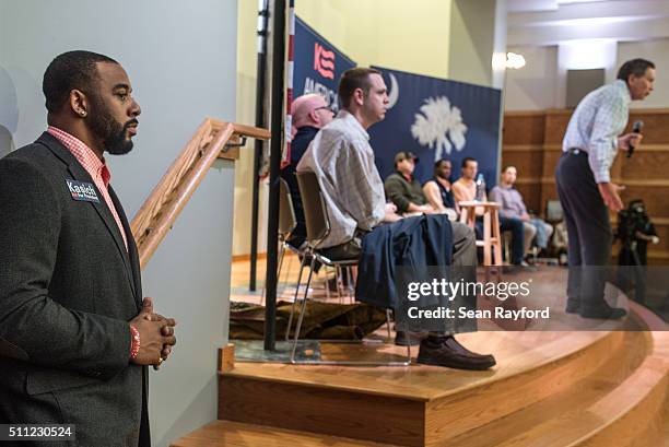 Former Clemson quarterback Tajh Boyd listens to Republican presidential candidate John Kasich during a town hall meeting at the university February...