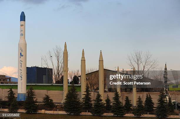 Replica Iranian missiles and a satellite launching rocket stand on display at the recently opened Holy/Sacred Defense Museum, a vast complex created...