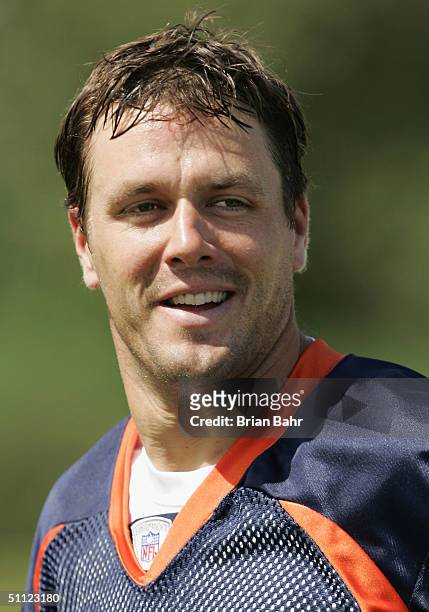 Quarterback Jake Plummer of the Denver Broncos jogs off the field after the first full session of training camp in Dove Valley on July 28, 2004 in...