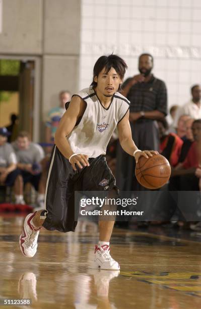 Yuta Tabuse of the Phoenix Suns dribbles the ball against the Atlanta Hawks during the Rocky Mountain Review Summer League at Salt Lake City...