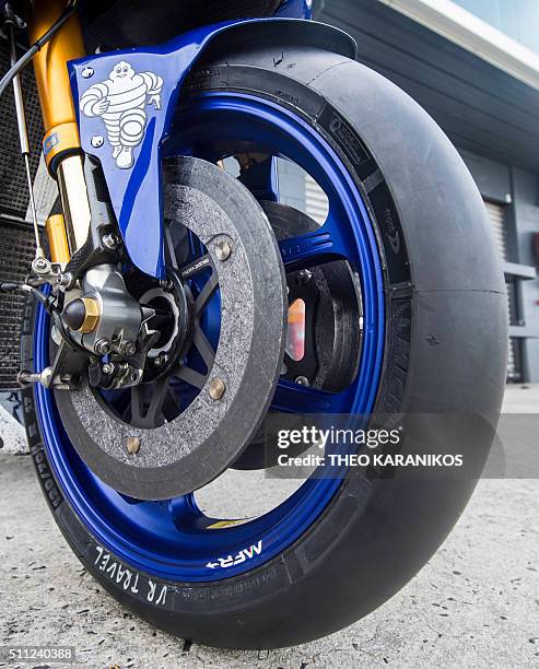 The front wheel of Movistar Yamaha's Spanish rider Jorge Lorenzo's bike is seen with the new Michelin tyre during the third day of the 2016...
