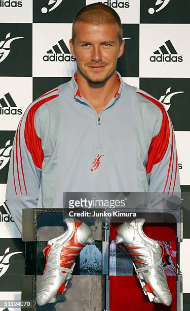 English football player David Beckham attends a press conference to introduce the David Beckham limited edition adidas PredatorPulse on July 29, 2004...