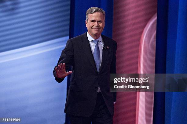 Jeb Bush, former Governor of Florida and 2016 Republican presidential candidate, waves as he arrives at a town hall event hosted by CNN at the...