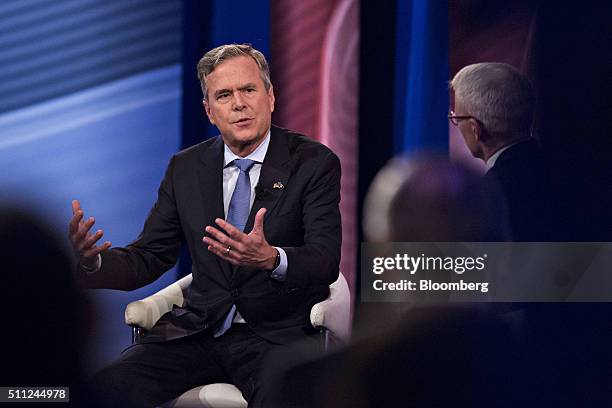 Jeb Bush, former Governor of Florida and 2016 Republican presidential candidate, left, speaks during a town hall event hosted by CNN at the...