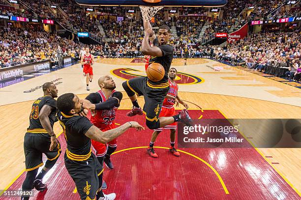 Tristan Thompson of the Cleveland Cavaliers dunks over E'Twaun Moore of the Chicago Bulls during the second half at Quicken Loans Arena on February...