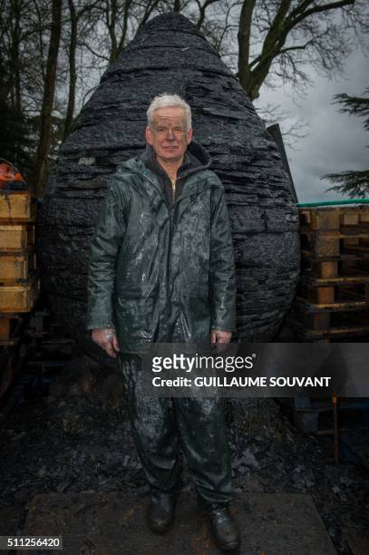 British artist Andy Goldsworthy poses near an art installation in progess, "egg-shaped cairn of slates", at the Chateau de Chaumont-sur-Loire in...