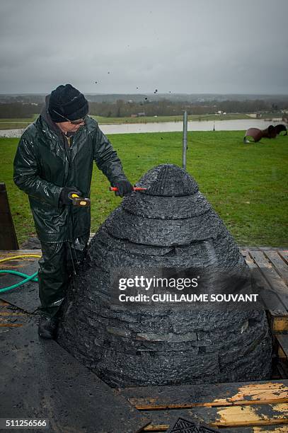 British artist Andy Goldsworthy works on an art installation in progess, "egg-shaped cairn of slates", at the Chateau de Chaumont-sur-Loire in...