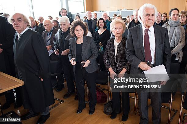 Holocaust survivors and witnesses William Glied, Irene Weiss, her daughter, Max Eisen and Mordechai Eldar and their lawyer Thomas Walther wait for...