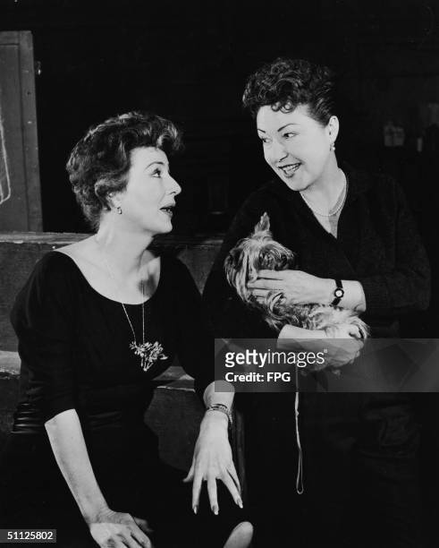 American actress, entertainer, and author Gypsy Rose Lee meets with actress Ethel Merman during the pre-production of the Broadway musical 'Gypsy,'...