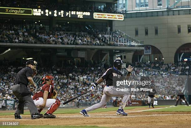 Felix Pie of the World Team watches the flight of the ball as he follows through on a swing during the New York Mercantile Exchange All-Star Futures...