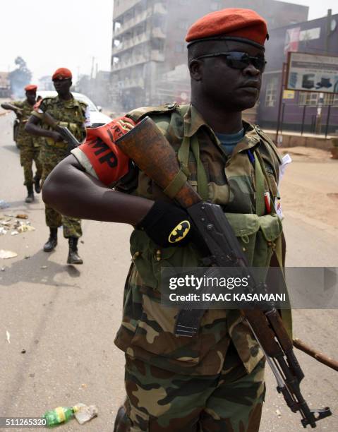 Uganda military police patrol streets of Kampala on February 19, 2016. Dozens of polling stations in Uganda were forced to open for a second day on...