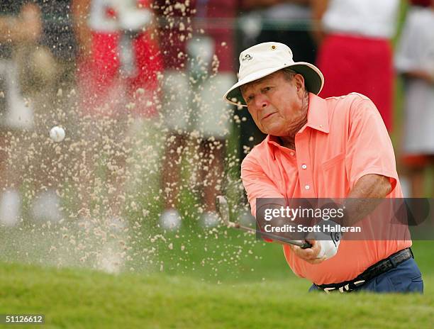 Arnold Palmer plays a bunker shot on the second hole during the first round of the 25th U.S. Senior Open at Bellerive Country Club on July 29, 2004...