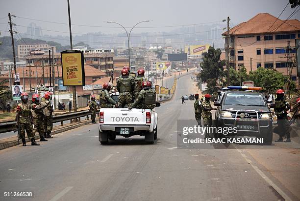 Ugandan military police patrol a street in Kampala on February 19 as a second day of voting in presidential elections got underway. Uganda's top...