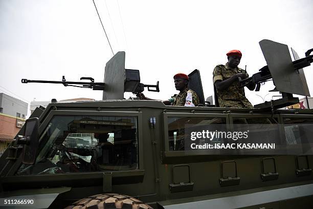 Ugandan military police patrol a street in Kampala on February 19 as a second day of voting in presidential elections got underway. Uganda's top...