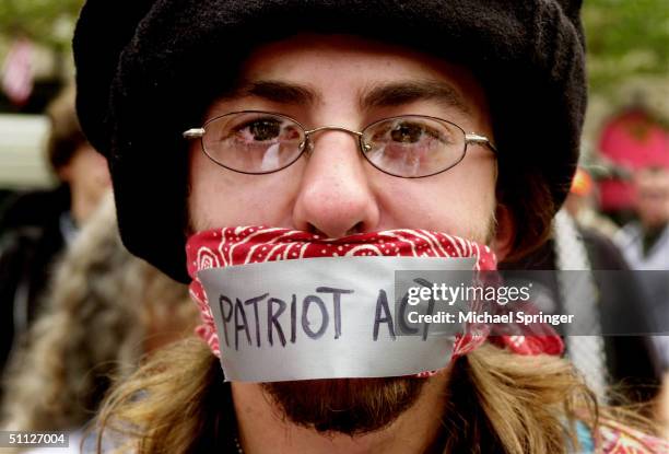 Man protests the Patriot Act during an anarchist rally on the final day of the Democratic National Convention at Copley Plaza July 29, 2004 in...