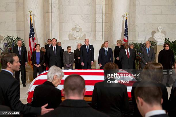 Family of late Supreme Court Justice Antonin Scalia take their seats as Supreme Court Justices stand for a private ceremony in the Great Hall of the...