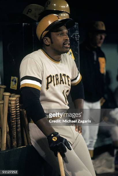 Al Oliver of the Pittsburgh Pirates sits against the bat rack inside the dugout during a game circa July of the 1973 MLB season. Al Oliver played for...