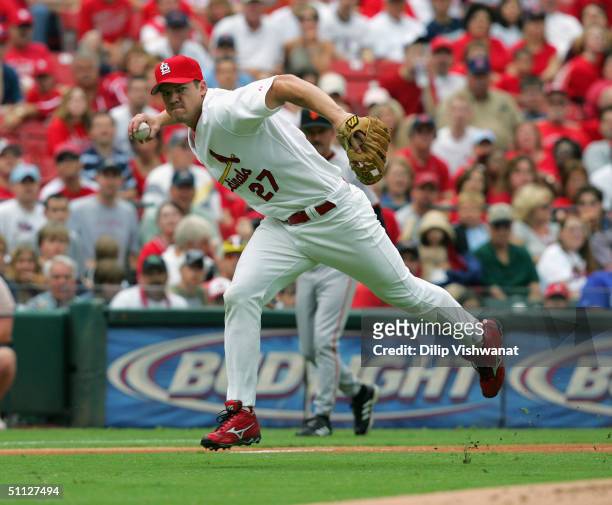 Third baseman Scott Rolen of the St. Louis Cardinals throws the ball to first base during the game against the San Francisco Giants on July 24, 2004...