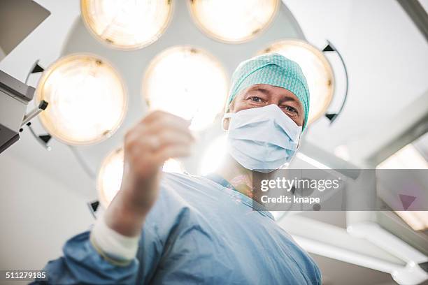 doctor doing surgery - plastic surgeon stock pictures, royalty-free photos & images
