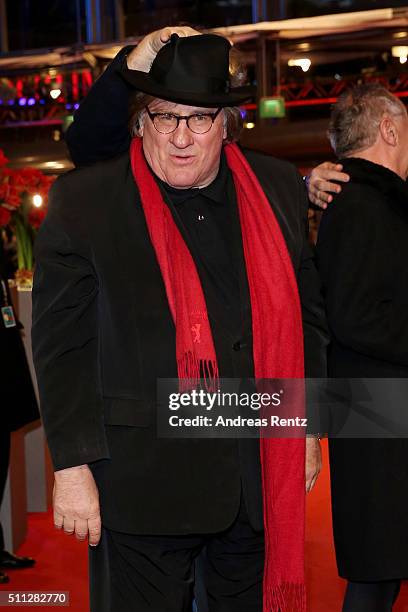 Actor Gerard Depardieu, wearing Dieter Kosslick's scarf, glasses and hat, attends the 'Saint Amour' premiere during the 66th Berlinale International...