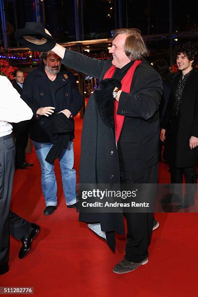 Actor Gerard Depardieu, wearing Dieter Kosslick's scarf, is joking around with Dieter Kosslick during the 'Saint Amour' premiere during the 66th...