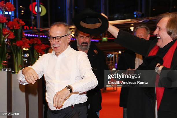 Gerard Depardieu, wearing Dieter Kosslick's scarf, also takes the festival director's hat during the Amour' premiere during the 66th Berlinale...