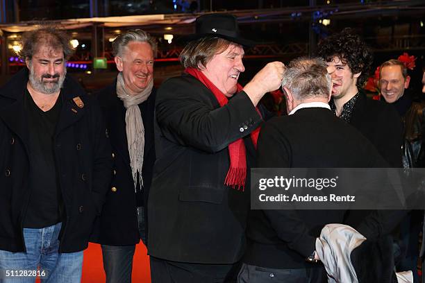 Gerard Depardieu, wearing Dieter Kosslick's scarf, and festival Director Dieter Kosslick joking around during the 'Saint Amour' premiere during the...