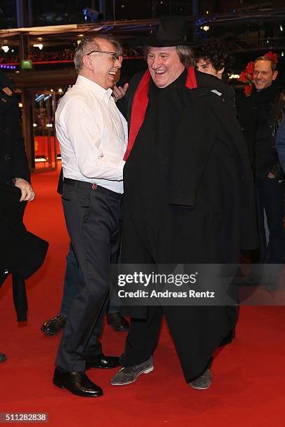 Festival Director Dieter Kosslick and actor Gerard Depardieu, wearing Dieter Kosslick's scarf, hat and coat, joking around during the 'Saint Amour'...