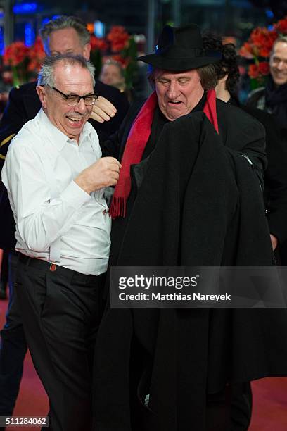Gerard Depardieu, wearing Dieters Kosslick's scarf and hat, is joking around with Dieter Kosslick during the 'Saint Amour' premiere during the 66th...