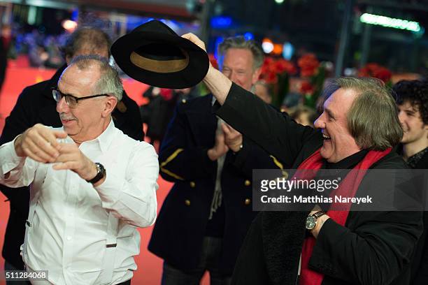 Gerard Depardieu, wearing Dieter Kosslick's scarf, also takes his hat during the 'Saint Amour' premiere during the 66th Berlinale International Film...